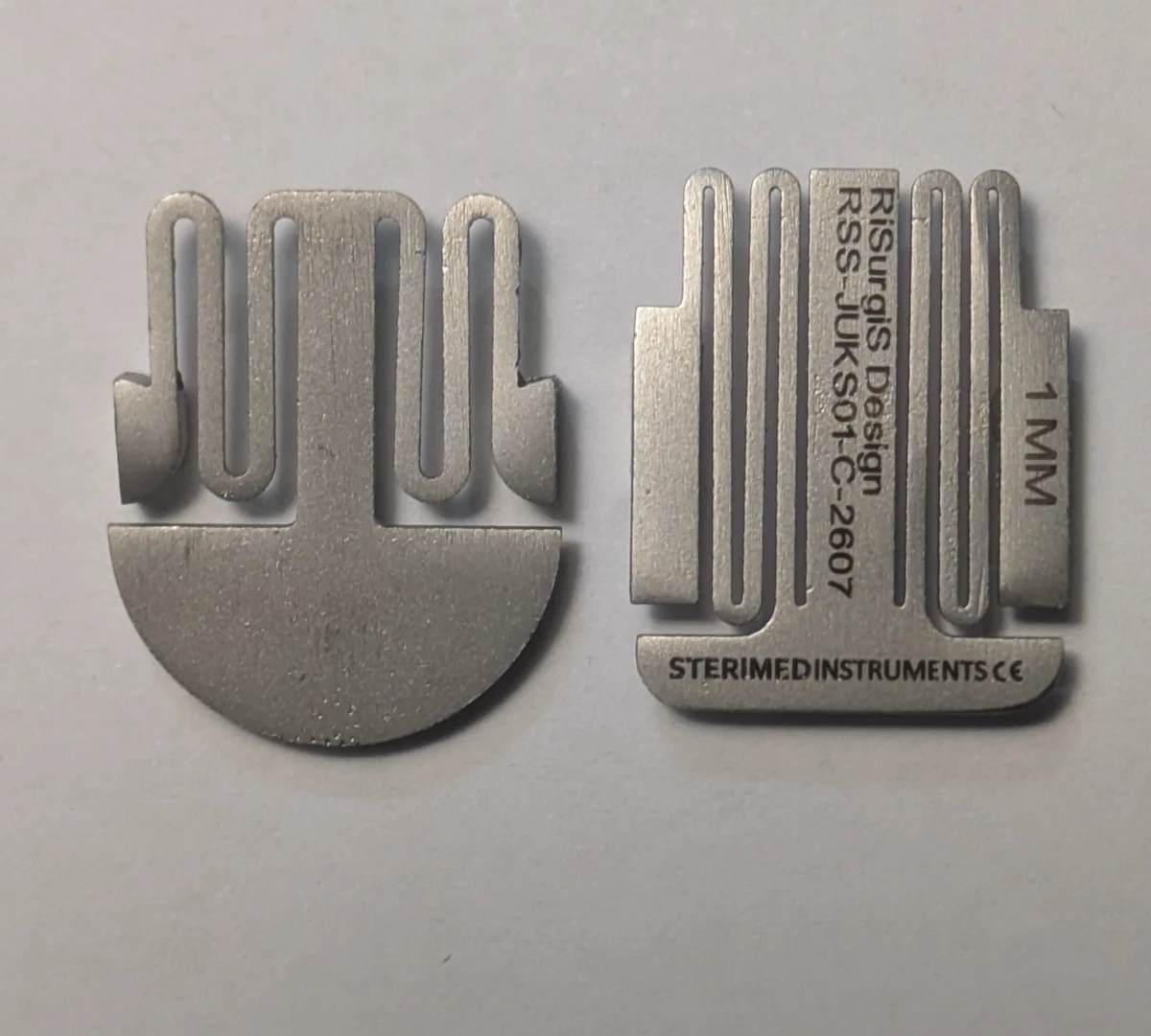 Early round-base JUKS on the left beside the current rectangular-base version on the right